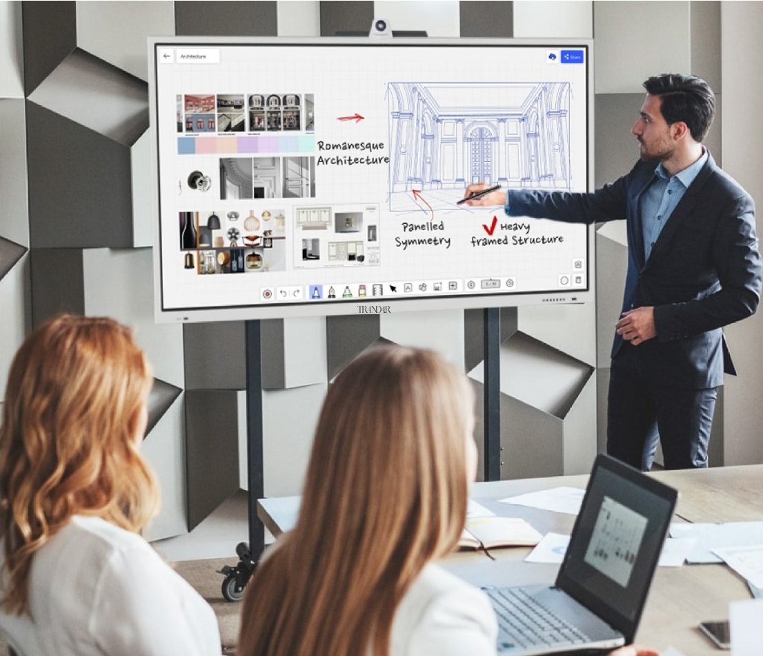 A designer annotates architecture sketches on a whiteboard on a mobile stand
